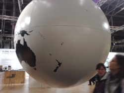 A giant globe inside the Bella Centre in Copenhagen shows New Zealand, an island in the South Pacific. 