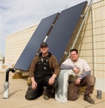 People installing solar panels in Dawson Creek