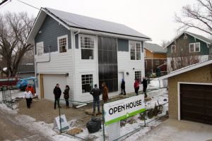 One of Edmonton's first carbon neutral, net-zero garage suites opened the doors to the public on Feb. 20, 2016. The home is heated using a solar wall, air-to-water heat pump and thermal energy storage, one of the first of its kind in Canada.