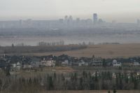 The Calgary horizon appears under a blanket of smog. 