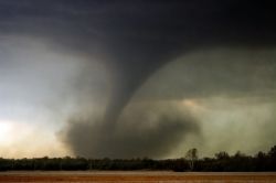 A funnel cloud touches down. 