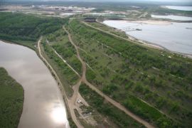 A Suncor oilsands tailings pond next to the Athabasca river. 