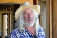 * Earthship founder, Michael Reynolds working on the Kinney Earthship.