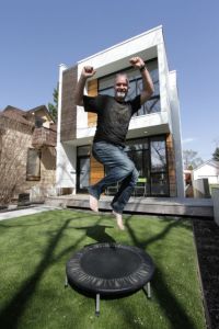 Louis Pereira in front of his innovative infill home in Edmonton, Alberta