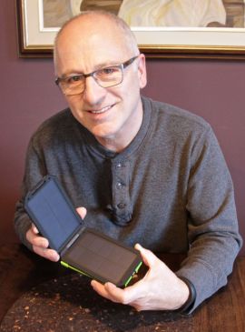 * David Dodge with the Cobra CPP 300 solar battery charger. 