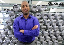 * Wilbur Maclean, a communications officer with the city of Medicine Hat, stands in front of a wall of smart meters. Medicine Hat has installed 26,000 smart meters. 