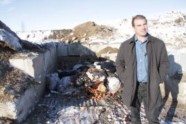 * Jamie Bakos with a pile of biochar feed stock behind. Take some waste wood, heat it up to 600 degrees C with no oxygen and you get biochar, bio-oil and syngas. Photo David Dodge, Green Energy Futures