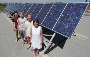 * Science teacher Stephanie Bennett with two alumni - all veterans of the Cochrane High School Sustainable Development Committee. 