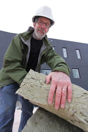 * Peter Amerongen uses this Roxul mineral wool insulation along with hard form, spray-in and blow-in cellulose insulation to build homes with more than double the insulation of a conventional home allowing the home to be powered and heated by solar energy and reach the status of net-zero energy.  Photo David Dodge, GreenEnergyFutures.ca