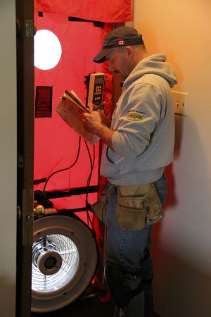 * The blower door test was invented by Harold Orr and reveals how well sealed a home is. A passive house must get below 0.6 air exchanges per hour. Photo David Dodge, GreenEnergyFutures.ca