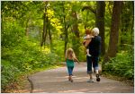 Woman walking on path with children