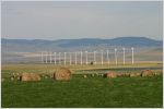 Wind turbines near mountains