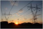 Sunset over electricity lines and towers