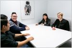 Women talking around a conference room table