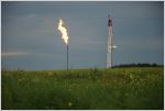 Drill site with flare at twilight