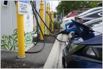 Electric vehicles at charging station.