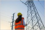 woman looking at electricity pylons