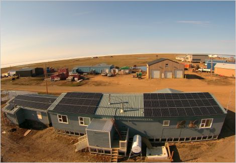 Solar installation on roof of building in small community