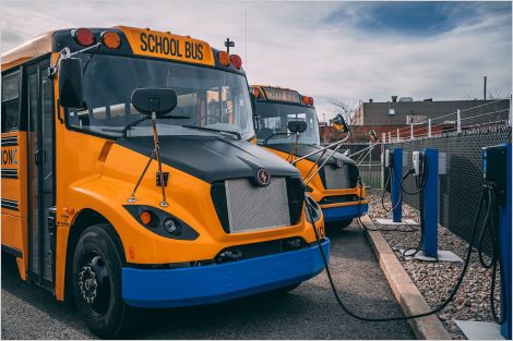 Electric school buses at charging stations