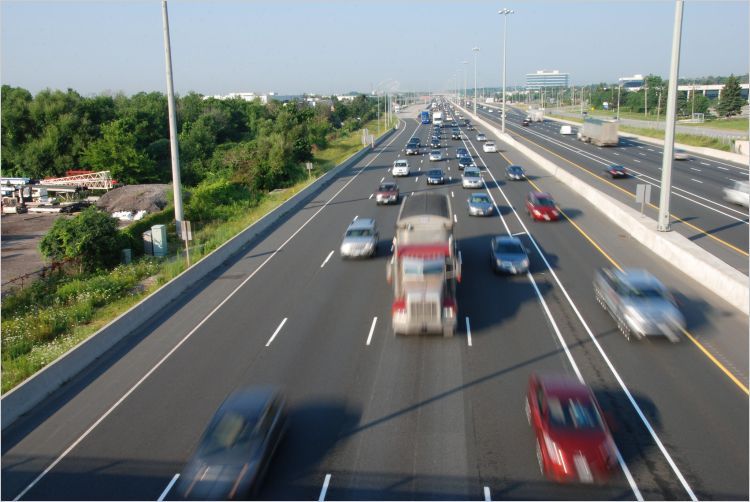 Semitrucks and passenger vehicles on the highway in Canada