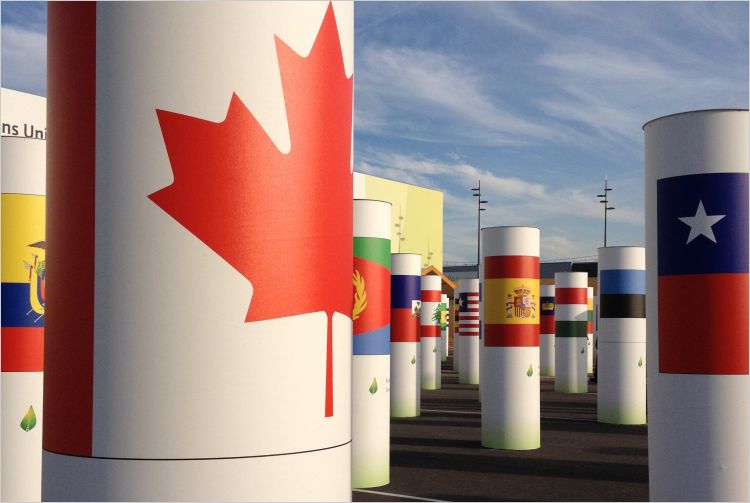 Canadian flag symbol in front of other other country images