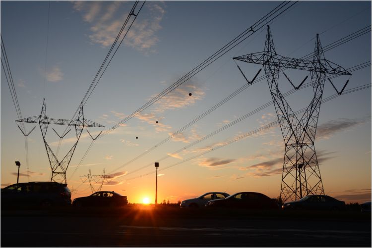 Sunset over electricity lines and towers