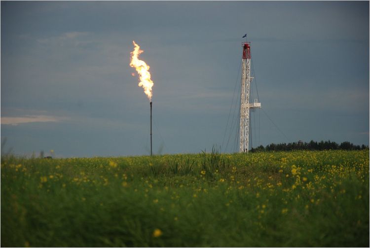 Drill site with flare at twilight