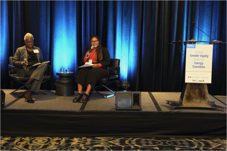 Heather Campbell and Calyssa Burke on stage at the Women in Alberta's Energy Transition event