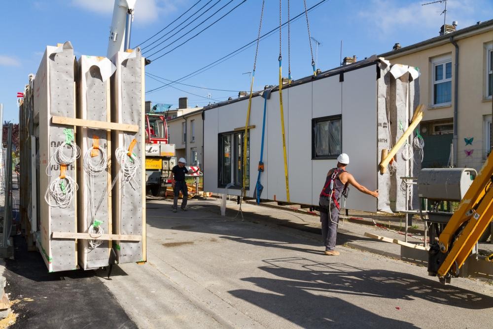 Two men working on a building construction site. 
