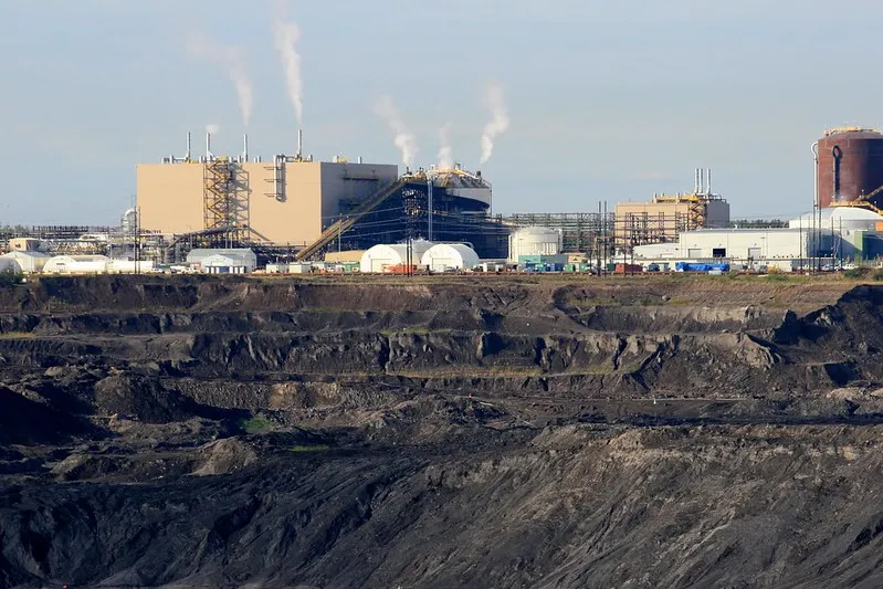 Oilsands site in Alberta, with the mine in the foreground and the facility in the background