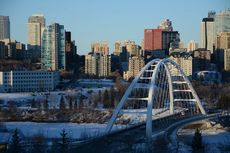 A photo of the Edmonton skyline in winter with snow on the ground