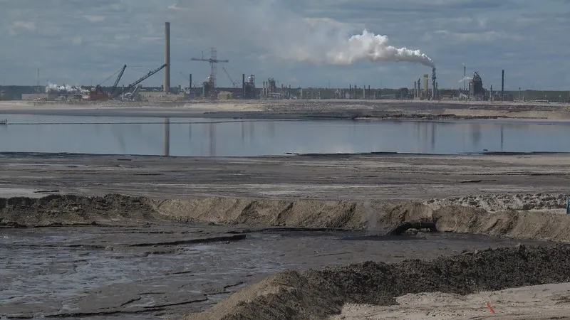 An oilsands refinery billowing smoke into the atmosphere