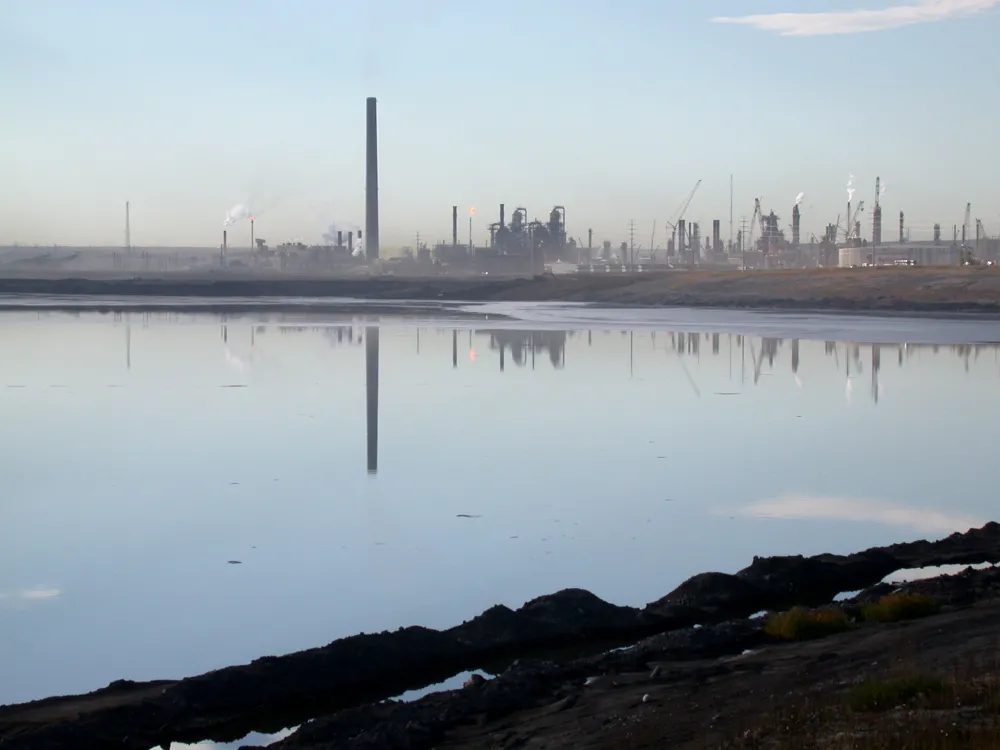 A view of the Syncrude facility across a tailings pond.