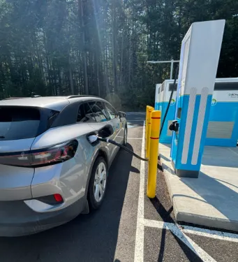 A Volkswagen ID.4 plugged in and charging at a BC Hyrdo EV charging station.