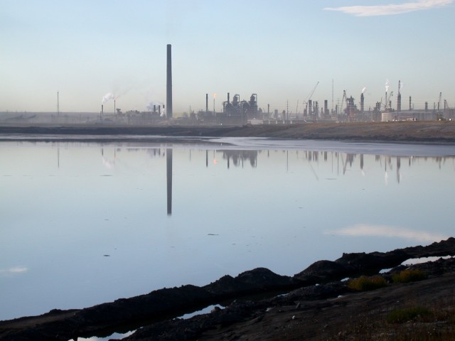 A view of the Syncrude facility across a tailings pond.