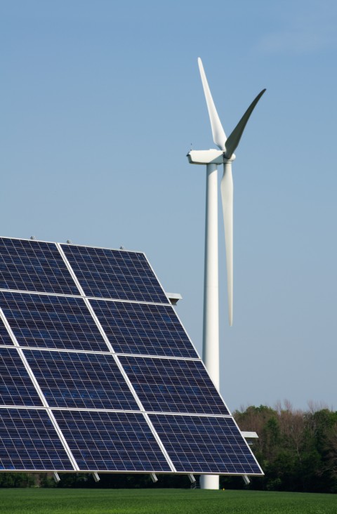 A solar panel and a wind turbine in a field in southwestern Ontario