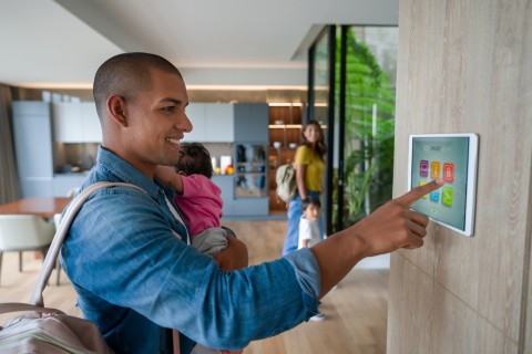 Family leaving the house locking the door using a smart home system