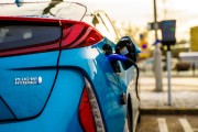 Plug-in electric hybrid passenger car at charging station