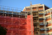 Multi-unit apartment building undergoing external retrofits
