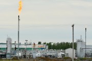 A plant flares gas in Alberta.