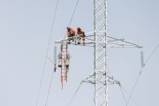 Workers maintaining transmission lines