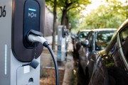 Close up of electric vehicle plugged into charger