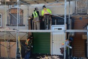 Construction workers working on an exterior retrofit