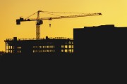 A crane is silhouetted during sunset