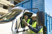 Trucking employees consulting on logistics