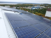 solar panels on the roof of a building in a remote community